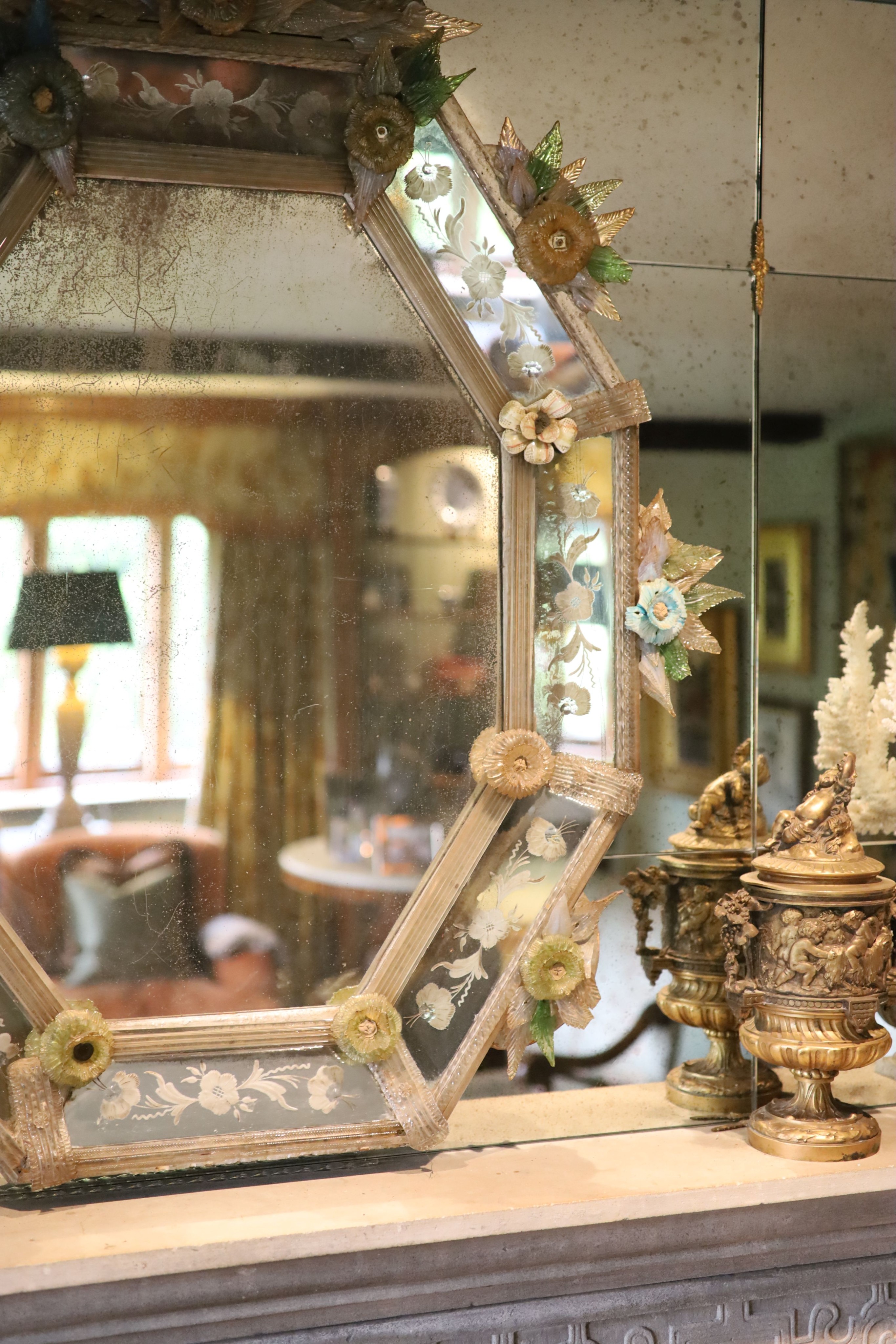 A Venetian etched glass wall mirror, with elaborate floral encrusted frame, width 91cm height 100cm